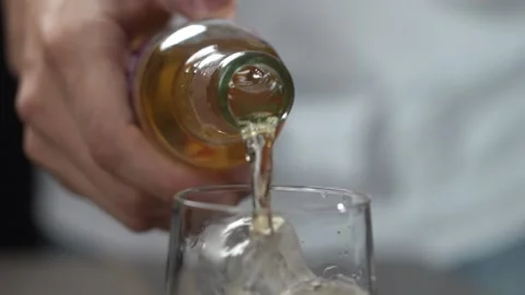 Making cocktail pouring ginger ale mixer... | Stock Video | Pond5