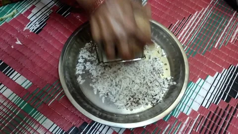 Making Coconut flakes by using grater Stock Footage 194477632