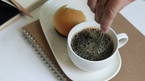 Making coffee and mixed well. Video stock 96111698