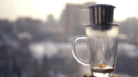 Making coffee in Asia, a drop falling into a glass bowl. Against the background 스톡 사진