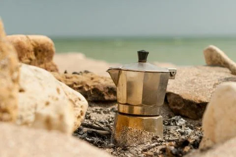 Making coffee on the beach. Stock Photos