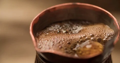 Making Coffee in cezve close up macro shot slow motion 4K video Stock Footage 98249901