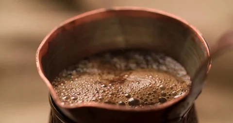 Making Coffee in cezve close up shot slow motion video Stock Footage 98249240