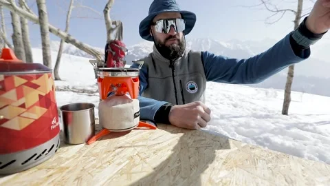 Making coffee in Cezve at winter mountains Stock Footage 171230984