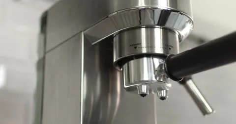 Making coffee by coffee machine into cup, espresso coffee coming out from an Stock Footage 196727873