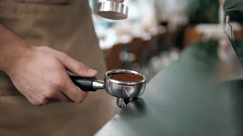 Making coffee in the coffee machine. Fresh espresso. Man prepare coffee. Barista Stock Footage 77869912