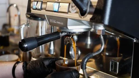 Making coffee with coffee maсhine Stock Photos