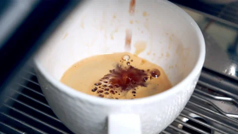 Making coffee in a coffee shop. The process of pouring black coffee into a mug Stock Footage 147742260