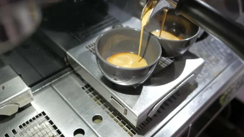 Making coffee. Coffee for two. Coffee maker - professional coffee machine . Stock Footage 108772604