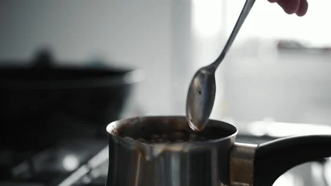 Making coffee in copper cezve over gas stove. Running coffee. Stock Footage 152845334