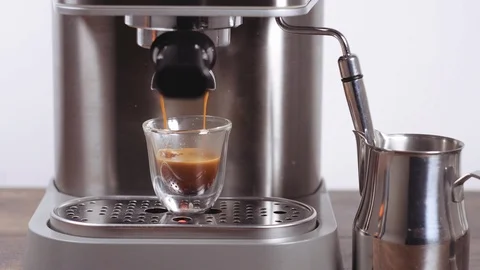 Making coffee. Cup of freshly brewed espresso with foam, crema. Stock Footage 112680304