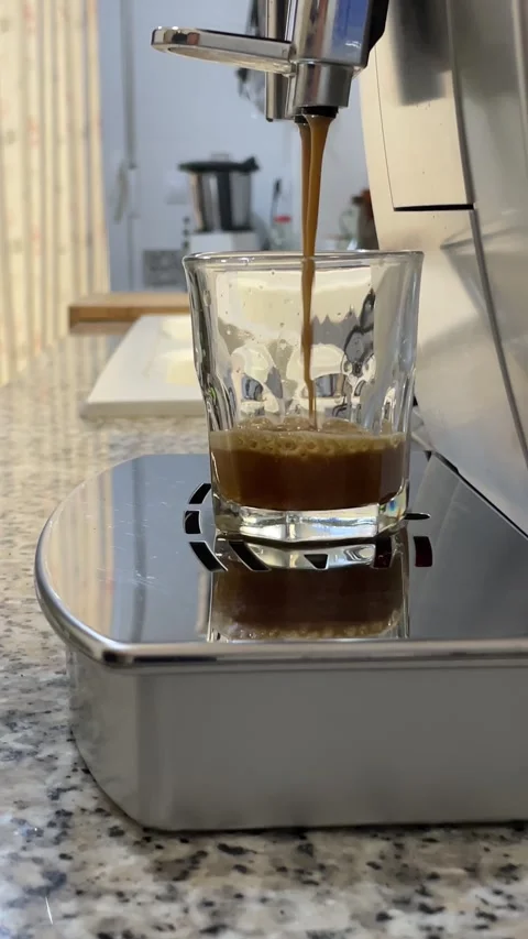 Making coffee espresso or ristretto in coffee machine. Home making hot Espresso Stock Footage 249019737