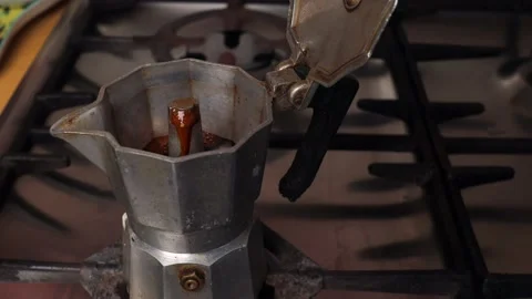 Making coffee in a geyser coffee maker on a gas stove Stock Footage 237231982