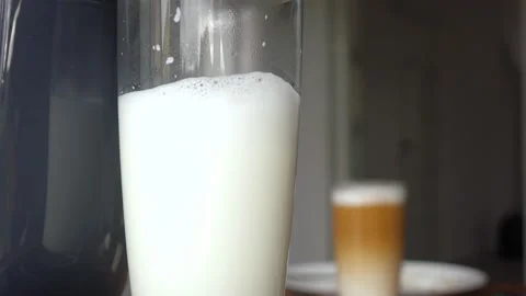 Making coffee latte in a capsule machine Video stock 135832419