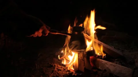 Making coffee over a campfire in the coffee maker Stock Footage 63181324