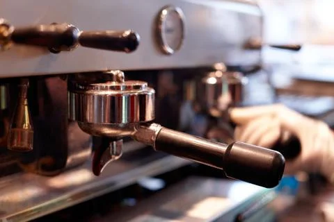 Making coffee in a professional coffee machine in a coffee shop Stock Photos