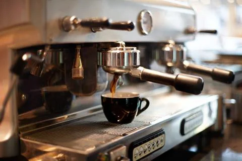 Making coffee in a professional coffee machine in a coffee shop Stock Photos