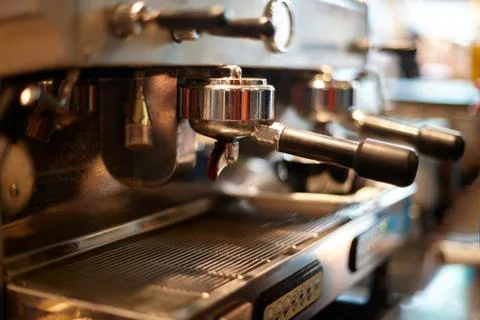 Making coffee in a professional coffee machine in a coffee shop Stock Photos