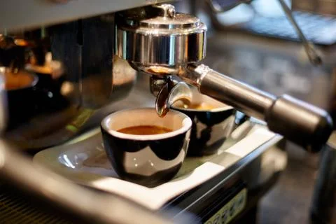 Making coffee in a professional coffee machine in a coffee shop Stock Photos