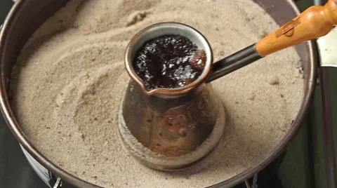 Making coffee on the sand Stock Footage 58724180