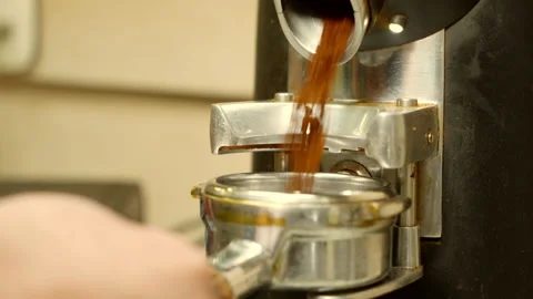 Making coffee. A special modern machine grinds and pours fragrant coffee Stock Footage 195502880