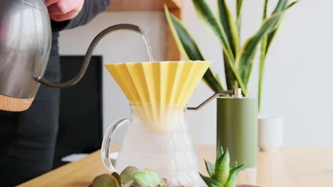 Making coffee. Speciality coffee at home. Barista pours water from the drip Stock Footage 150301078