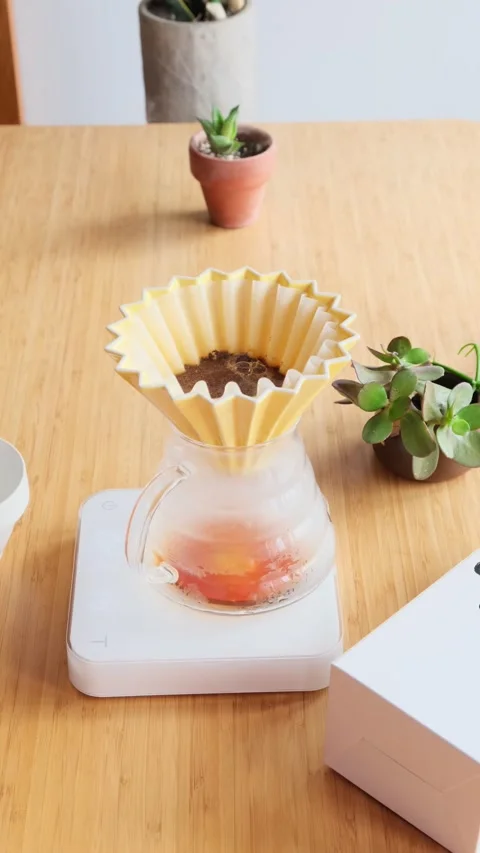 Making coffee. Speciality coffee at home. Barista pours water from the drip Stock Footage 153603476