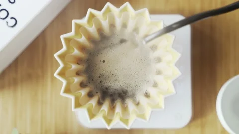 Making coffee. Speciality coffee at home. Barista pours water from the drip Stock Footage 153603976