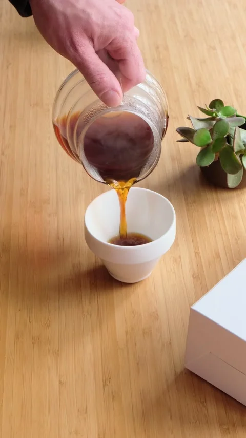 Making coffee. Speciality coffee at home. Barista pours water from the coffee Stock Footage 154092836