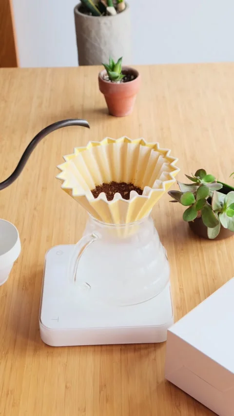 Making coffee. Speciality coffee at home. Barista pours water from the drip Stock Footage 154092864