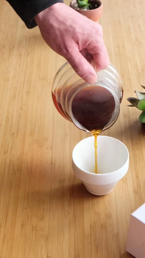 Making coffee. Speciality coffee at home. Barista pours water from the coffee Stock Footage 154092897