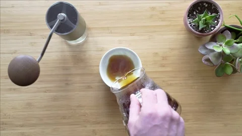 Making coffee. Speciality coffee at home. Barista pours water from the coffee Stock Footage 154093065