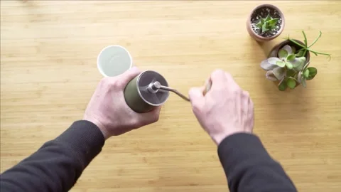 Making coffee. Speciality coffee at home. Barista grinds fresh coffee in a Stock Footage 154093178