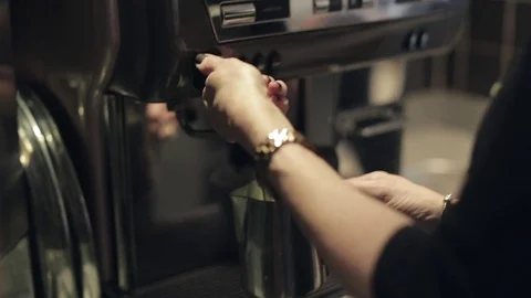 Making a Coffee - Steaming the Milk Stock Footage 70772301