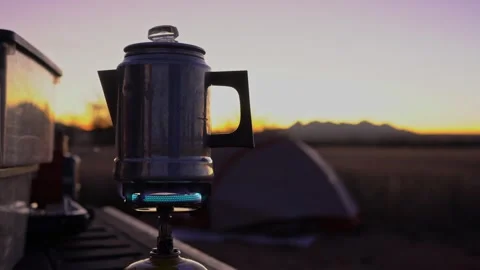 Making coffee before sunrise while camping Stock Footage 321101625