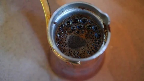 Making coffee in turk on the sand. Stock Footage 116769466