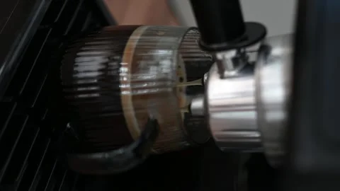 Making coffee using a modern espresso machine on a wooden table on a light Stock Footage 306568856