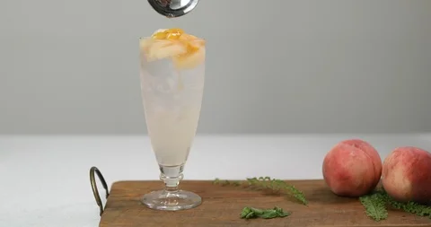 Making cold peach compote ade for summer drink Video stock 113914582