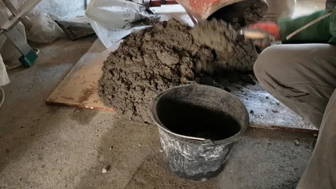Making concrete by hand Stock Footage 104772926