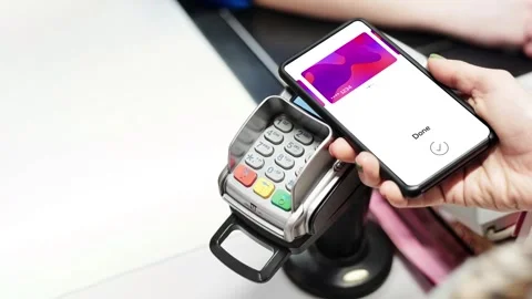 Making a Contactless Mobile Payment with a Smartphone at Shop Counter 스톡 동영상 266281934