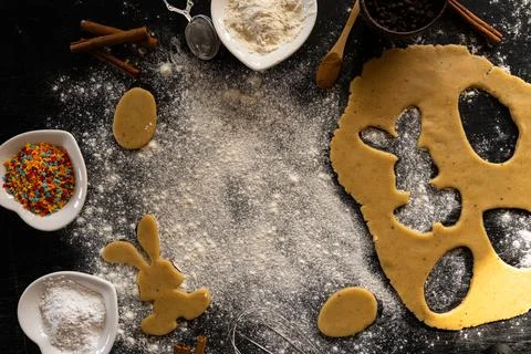 Making cookies for Easter. Bunny cut out of the dough. Traditional Easter bun Stock Photos