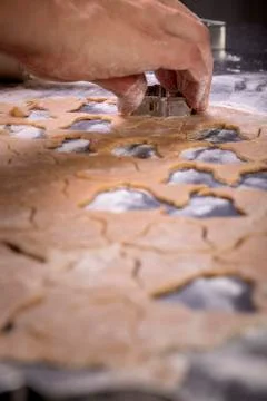 Making cookies on kitchen table, Roll out the dough and molds to cut , Select Foto stock