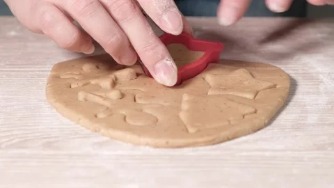 Making cookies in the shape of a bell from dough using a cookie cutter with Video stock 223524880