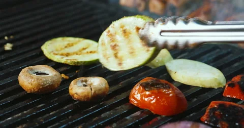 Making cooking grilled vegetables - champignons mushrooms, squash zucchini Video stock 136074528