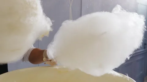 Making cotton candy at a fun fair stand Stock Footage 321191496