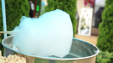 Making cotton candy or candy floss Stock Footage 71854784
