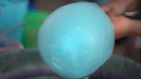 Making cotton candy or candy floss in street food market Stock Footage 155086374
