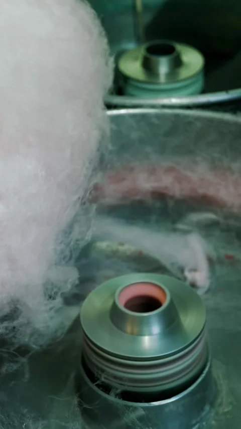 Making cotton candy or candy floss in street food market. Amusement park. Stock Footage 315364709