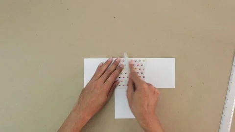 Making crafts. Folding scrapbook paper. Stock Footage 168727613