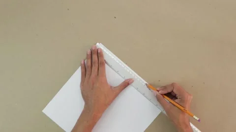 Making crafts. Tracing marks on white cardstock Vídeos de archivo 168727937